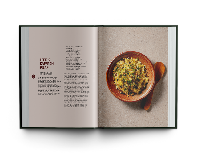 Open cookbook showing a page with a recipe for 'Leek & Saffron Pilaf' and an image of the dish.