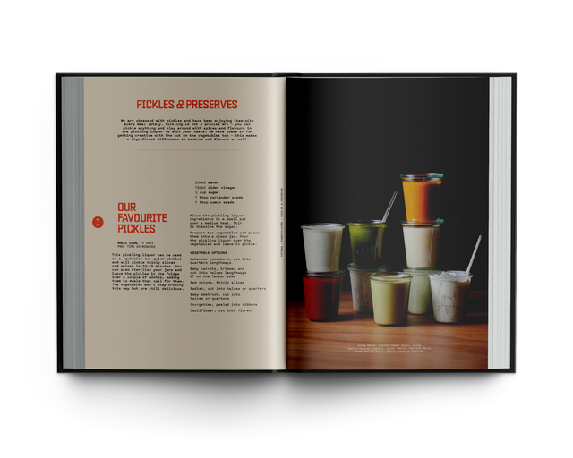 Open book showing a page with text and a photograph of drinks on a wooden surface.