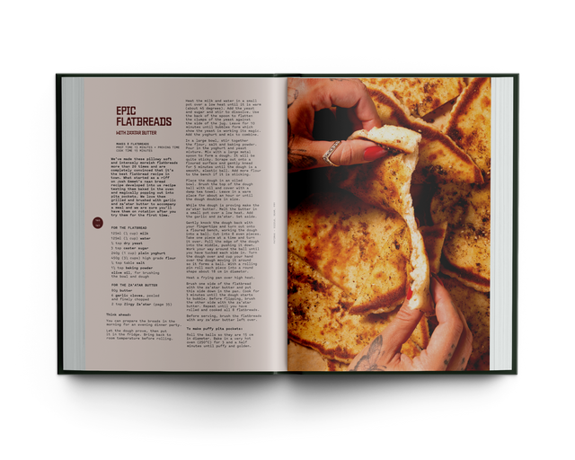 Open book showing a recipe for flatbreads with a close-up of hands holding bread.