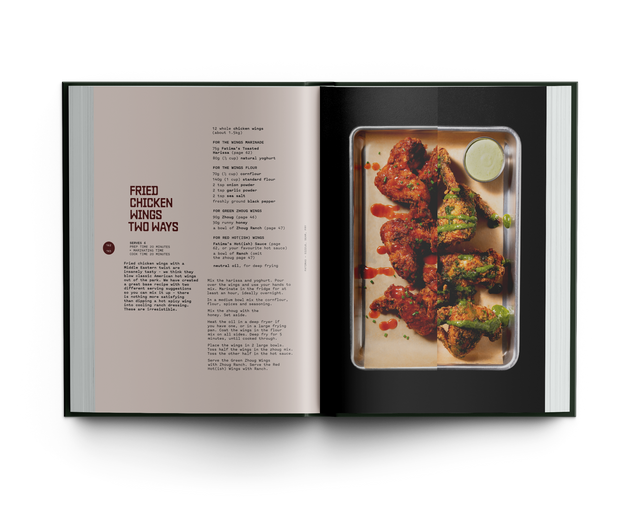 Open cookbook showing a recipe for fried chicken with a photo of the dish on a white background