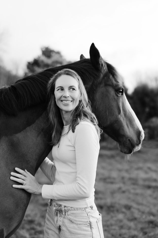 Dana Winter. Author and illustrator. Standing next to her horse Sage.