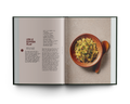 Open cookbook showing a page with a recipe for 'Leek & Saffron Pilaf' and an image of the dish.