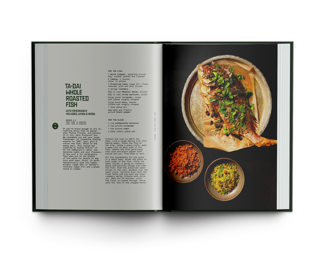 Open cookbook showing a recipe for whole roasted fish with side dishes.