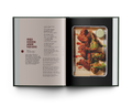 Open cookbook showing a recipe for fried chicken with a photo of the dish on a white background